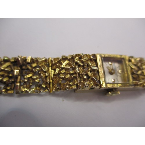 63 - A vintage gold cased and strapped ladies wrist watch, approx. gross weight 24.4g, not tested as to f... 