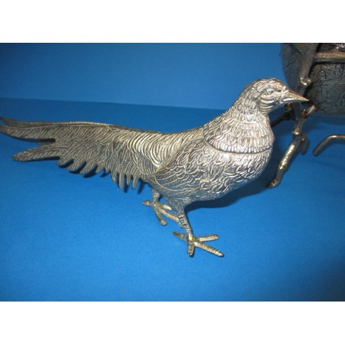 128 - Table decorations consisting of 2 white metal pheasants and a covered pot with a nesting bird