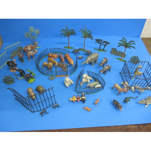 163 - A parcel of 1930s die-cast zoo figures, to include various animals and fencing, some by Britain’s, m... 