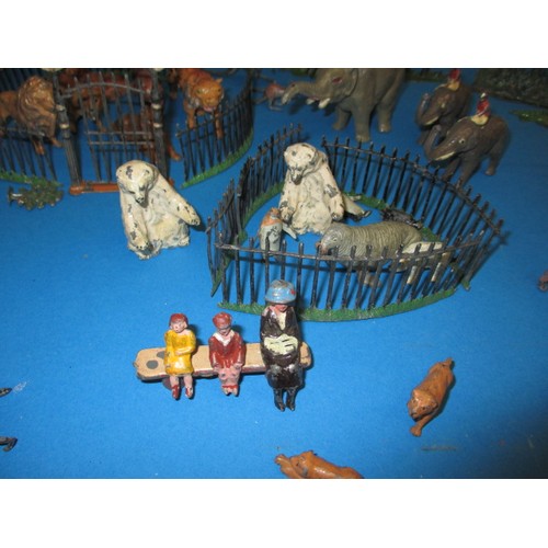 163 - A parcel of 1930s die-cast zoo figures, to include various animals and fencing, some by Britain’s, m... 