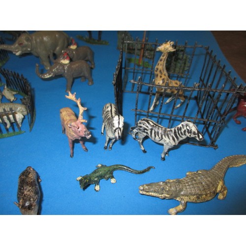 163 - A parcel of 1930s die-cast zoo figures, to include various animals and fencing, some by Britain’s, m... 