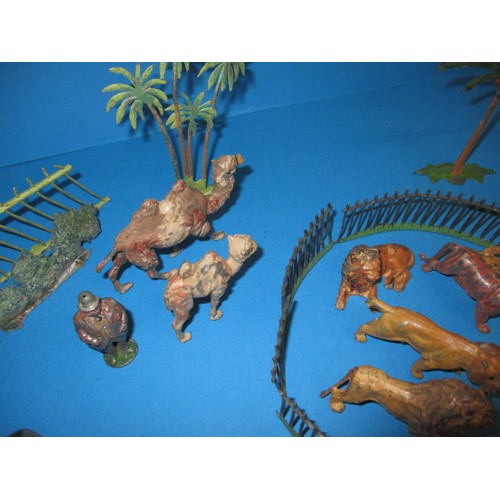 163 - A parcel of 1930s die-cast zoo figures, to include various animals and fencing, some by Britain’s, m... 