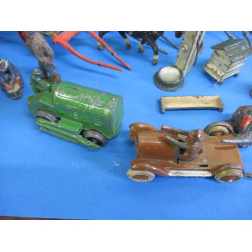 164 - A large quantity of early 20th century die-cast farm items, to include animals and carts, some by Br... 