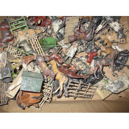 164 - A large quantity of early 20th century die-cast farm items, to include animals and carts, some by Br... 