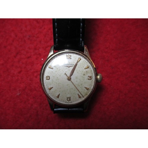 64 - A vintage 9ct gold Longines wrist watch, in current working order, approx. dial size 30mm, having us... 