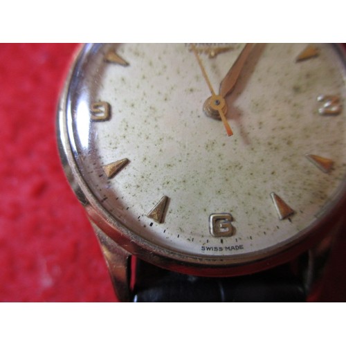 64 - A vintage 9ct gold Longines wrist watch, in current working order, approx. dial size 30mm, having us... 