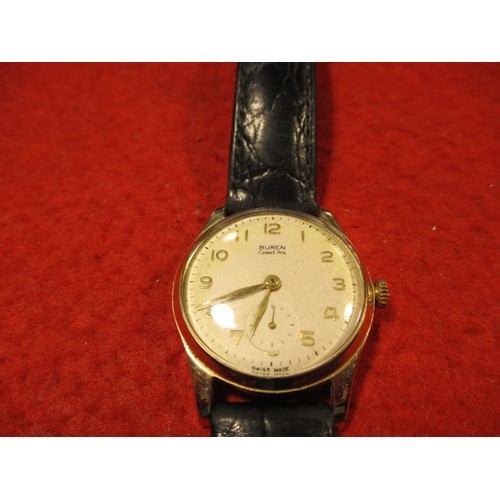 65 - A 1950s Buren Grand Prix 9ct gold cased wrist watch, in current working order, approx. dial size 27m... 