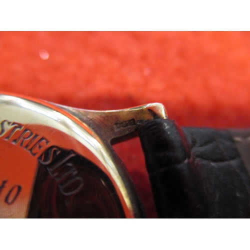 65 - A 1950s Buren Grand Prix 9ct gold cased wrist watch, in current working order, approx. dial size 27m... 