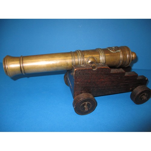 147 - A 19th century bronze signal cannon on later wood carriage, cannon marked with serial numbers, appro... 