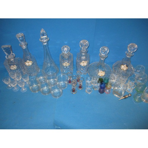 235 - A parcel of glass decanters and numerous drinks glasses, some in sets, and with 6 Coalport decanter ... 