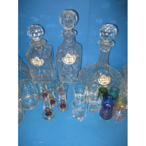 235 - A parcel of glass decanters and numerous drinks glasses, some in sets, and with 6 Coalport decanter ... 