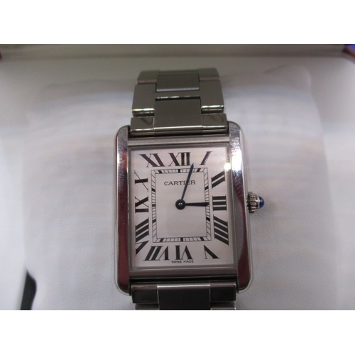 75 - A Cartier ‘TANK’ watch in good working order with box and paperwork, in used condition