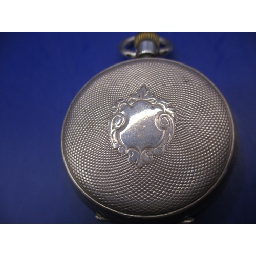 69 - A continental 875 silver cased open face pocket watch, runs well when wound and with general use-rel... 