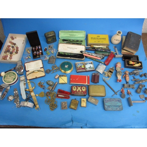 A parcel of interesting collectables to include pens, lighters, tins, golly badges and die-cast models, all in used condition