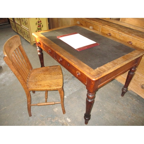 A 19th century writing table with 2 frieze drawers and leather inset top. With oak country house chair. Approx. size of desk width 122cm, depth 81cm, height 74cm, in used condition with use-related marks