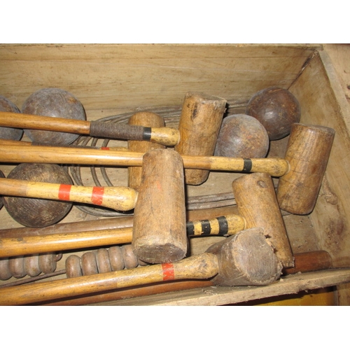 160 - A vintage croquet set in original wood box, having been well used