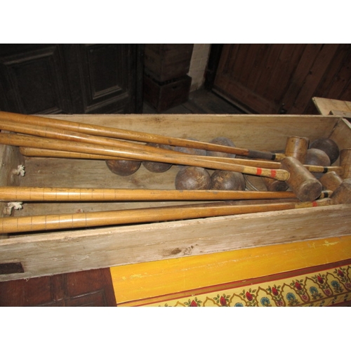 160 - A vintage croquet set in original wood box, having been well used