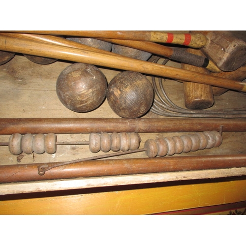 160 - A vintage croquet set in original wood box, having been well used