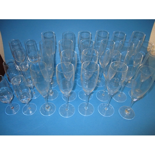 237 - A large quantity of champagne flutes, all with no observed damage, various sizes