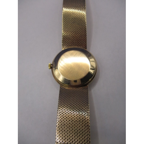 74 - A 9ct yellow gold Omega automatic De Ville watch, with full length bracelet strap and date window, i... 