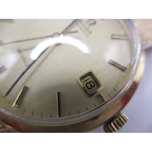 74 - A 9ct yellow gold Omega automatic De Ville watch, with full length bracelet strap and date window, i... 