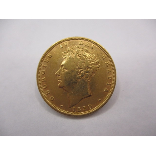 A George IV Bare head sovereign dated 1830, circulated but having very good definition of features