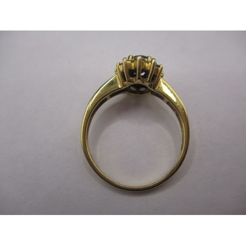 21 - An 18ct gold, diamond and sapphire ring, with sapphire set shoulders. Approximate ring size N, appro... 