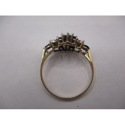 29 - A 9ct gold diamond and sapphire ring. Approximate ring size N+, approx. weight 1.7g. With use relate... 