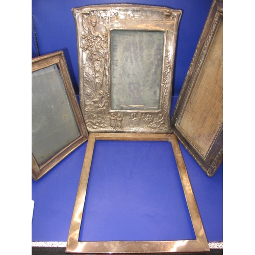 101 - 4 Antique sterling silver mounted photo frames, one being Edwardian with embossed fairies, some dama... 