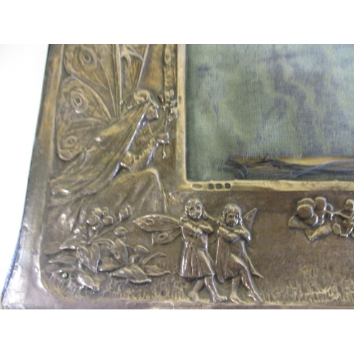 101 - 4 Antique sterling silver mounted photo frames, one being Edwardian with embossed fairies, some dama... 