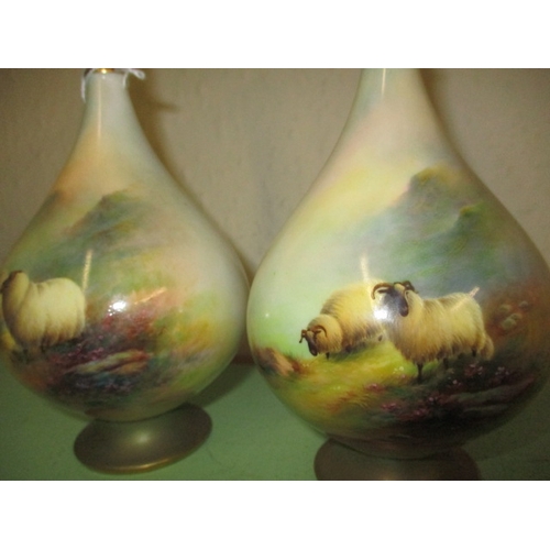 144 - A pair of Royal Worcester vases depicting sheep both signed E Barker approx. height 20cm, both with ... 