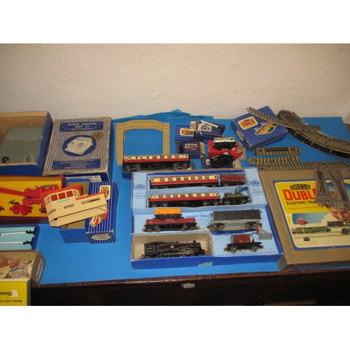 151 - A mid 20th century Hornby Meccano 00 gauge railway set, being 3 rail, with numerous additions, in go... 