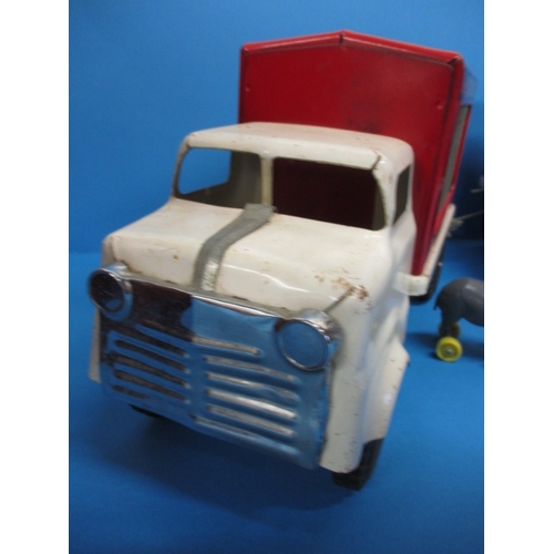 263 - A vintage Tri-ang circus truck and trailer, having some animals, in play worn condition with missing... 