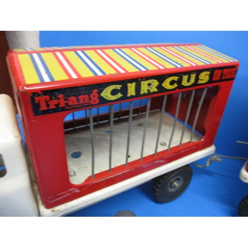 263 - A vintage Tri-ang circus truck and trailer, having some animals, in play worn condition with missing... 