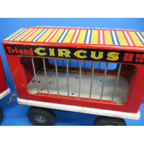 263 - A vintage Tri-ang circus truck and trailer, having some animals, in play worn condition with missing... 