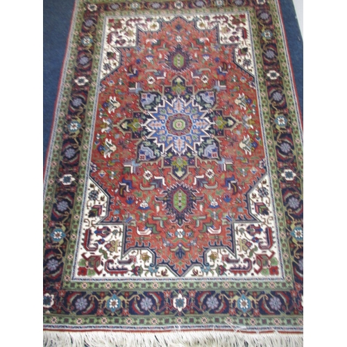 294 - A vintage hand knotted Persian Tabriz wool rug, having wall hanging web to back, approx. size 150x10... 