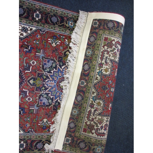 294 - A vintage hand knotted Persian Tabriz wool rug, having wall hanging web to back, approx. size 150x10... 