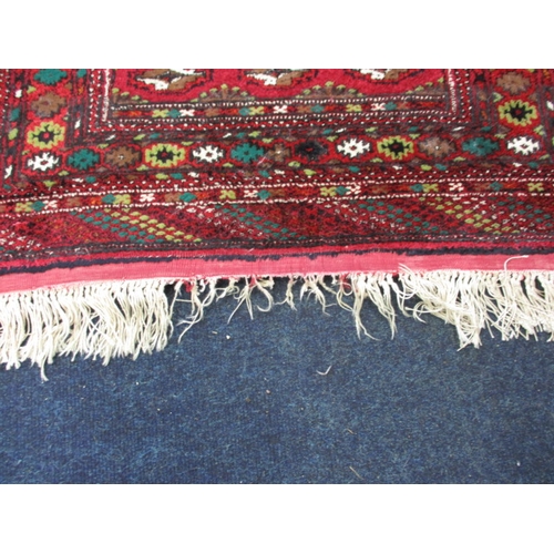 295 - An antique hand woven silk Bokhara rug, in good used condition with a little fraying to tassels, hav... 