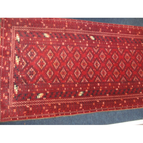 297 - A vintage Bokhara hand knotted wool rug, approx. size 204x102, in good pre-owned condition