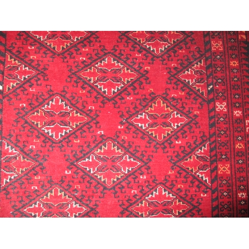 297 - A vintage Bokhara hand knotted wool rug, approx. size 204x102, in good pre-owned condition