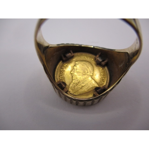 42 - A 9ct gold ring with 1/10 Krugerrand coin dated 1984, approx. ring size ‘R+’ approx. gross weight 8.... 