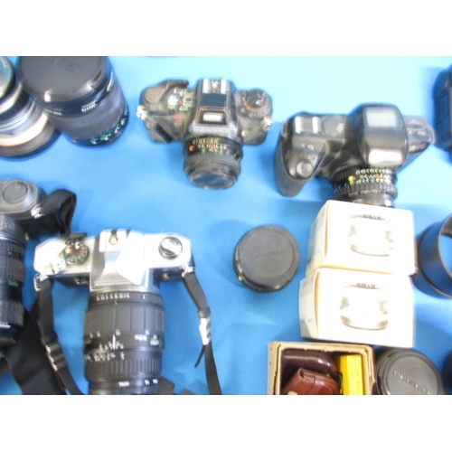 261 - A large quantity of vintage cameras and accessories, all in used condition and not tested as to func... 