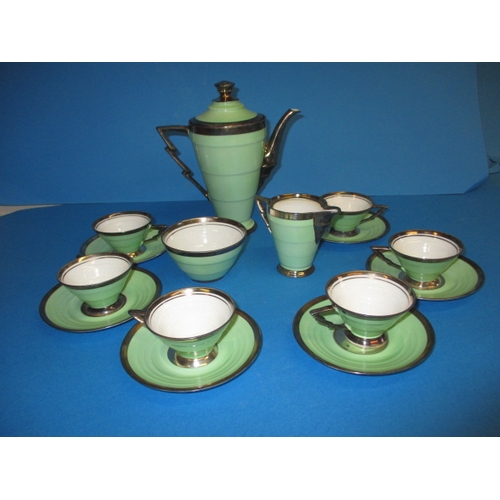 268 - An early 20th century art deco coffee set, continental porcelain with sterling silver decoration, in... 