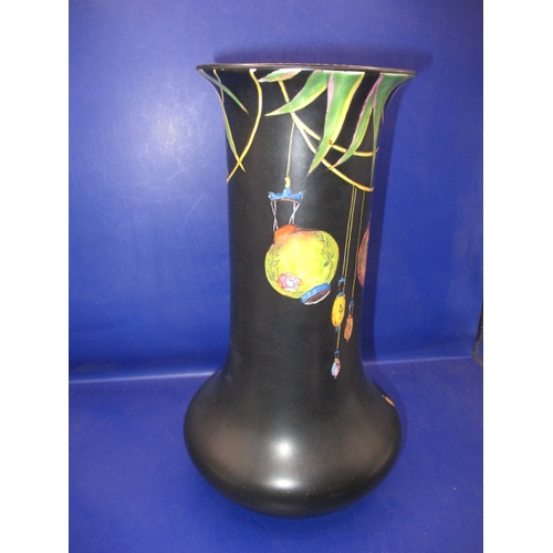 269 - A 1930s Crown Ducal vase, having hand painted Chinese lanterns over a black ground, in good used con... 