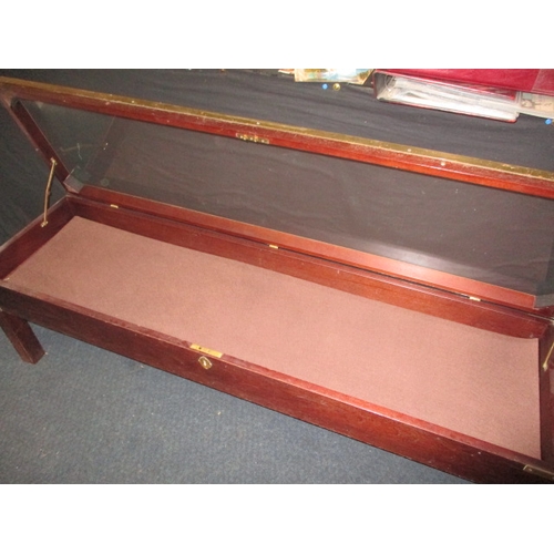 304 - A vintage bijouterie table, with lift up glazed top and brass mounts, in good used condition, approx... 