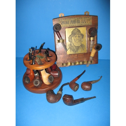 272 - A parcel of vintage pipes, to include a wall mounted rack and a comoys desk top stand, all in used c... 