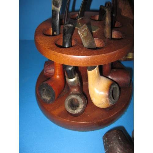 272 - A parcel of vintage pipes, to include a wall mounted rack and a comoys desk top stand, all in used c... 