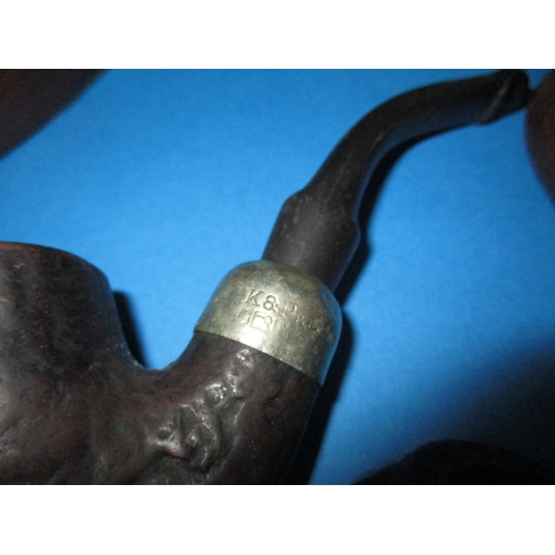 272 - A parcel of vintage pipes, to include a wall mounted rack and a comoys desk top stand, all in used c... 