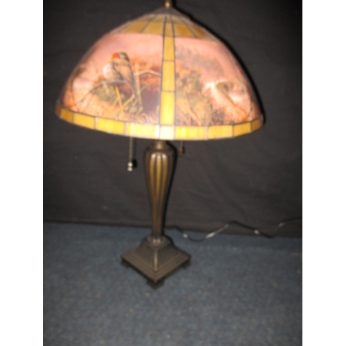 284 - A contemporary table lamp, with robin decoration. Having use related marks