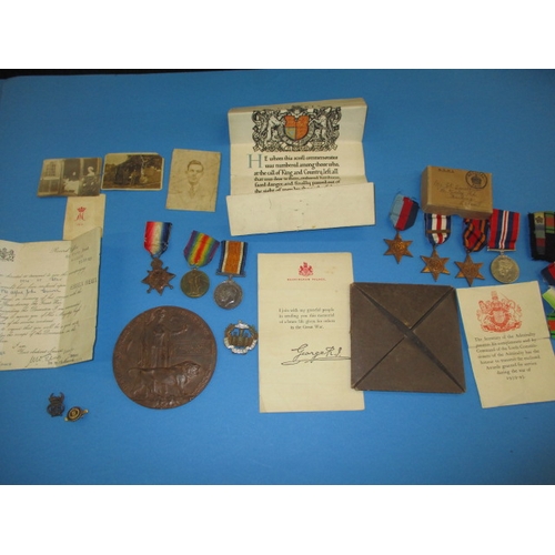 A WWI medal trio and memorial plaque to 3-1120 A J Guiver, Essex Reg, also his sons WWII medals, photos and papers, all in good used condition